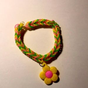 The bracelet is called surprise spring The colors are pink green and yellow